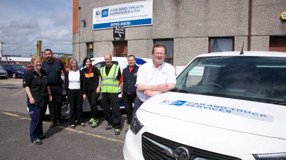 Car &amp; Truck Swindon team standing next to van